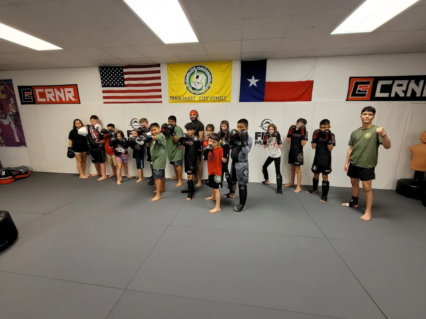 Kids in a standing striking drill during Kids Kickboxing class