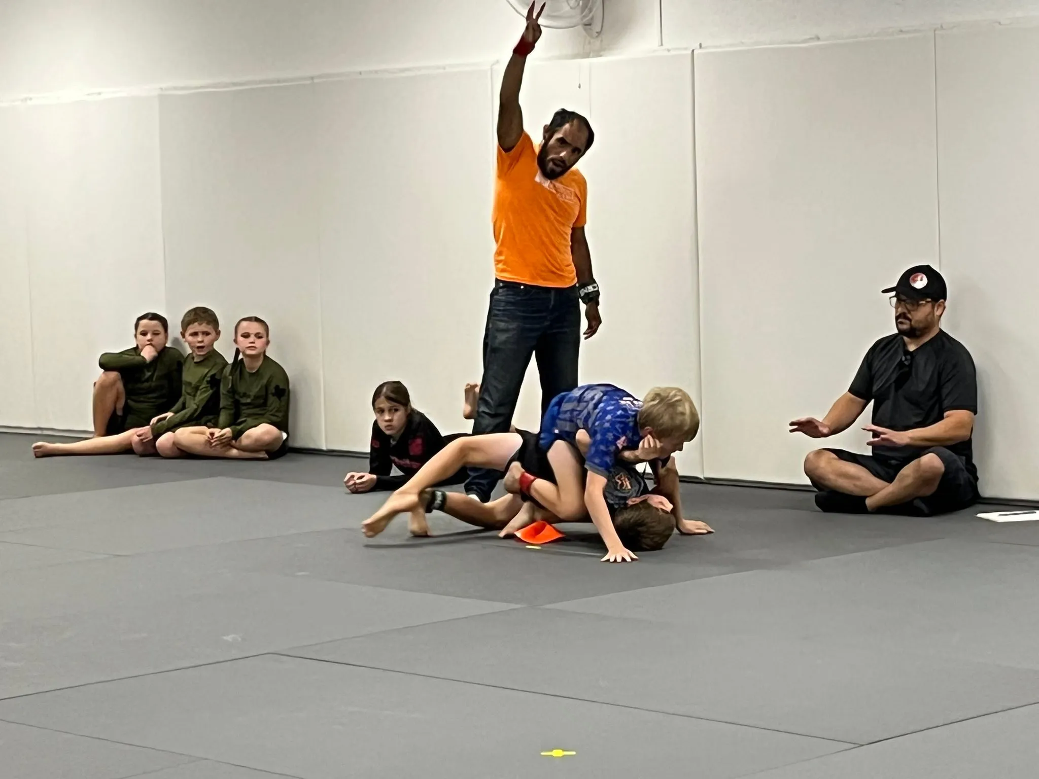 Coach refereeing the youngest cubs grappling at Dynamic Martial Arts