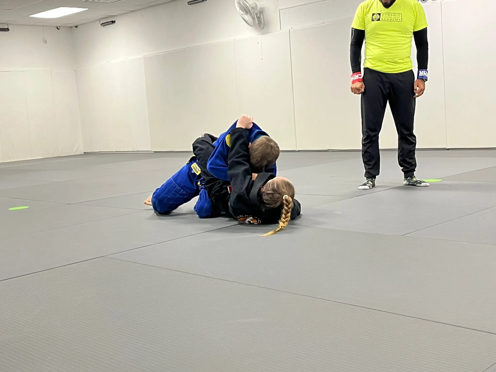 Kids rolling in the Gi during Kids Jiu-Jitsu class
